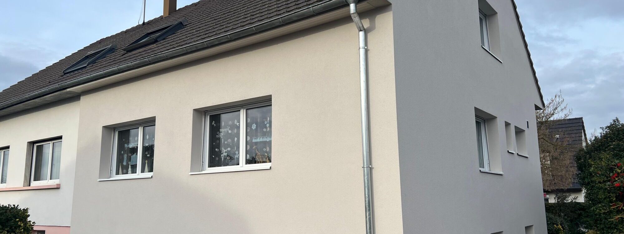 Isolation ext&eacute;rieure et ravalement de fa&ccedil;ade d&rsquo;une maison accol&eacute;e &agrave; Sausheim (Haut-Rhin) Belfort